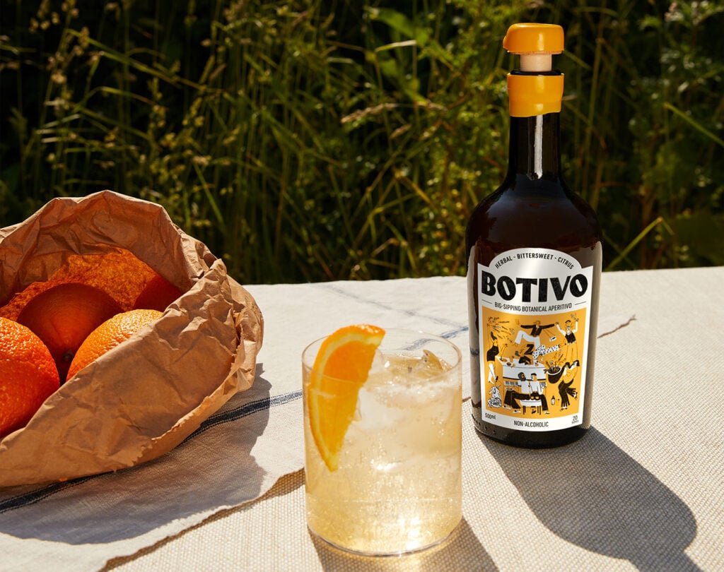 A bottle of Botivo and oranges
