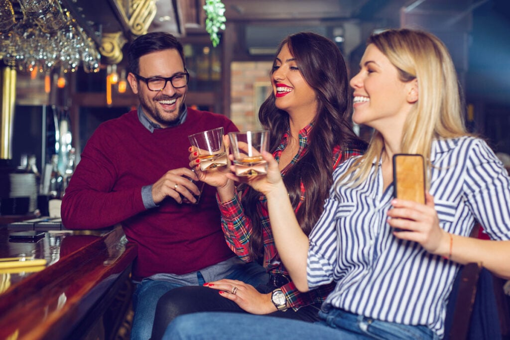 People drinking whisky